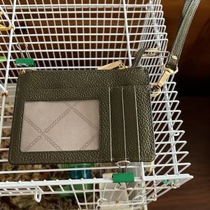 Small wristlet for ID and credit cards, also a ring for keys. Used 2 times.